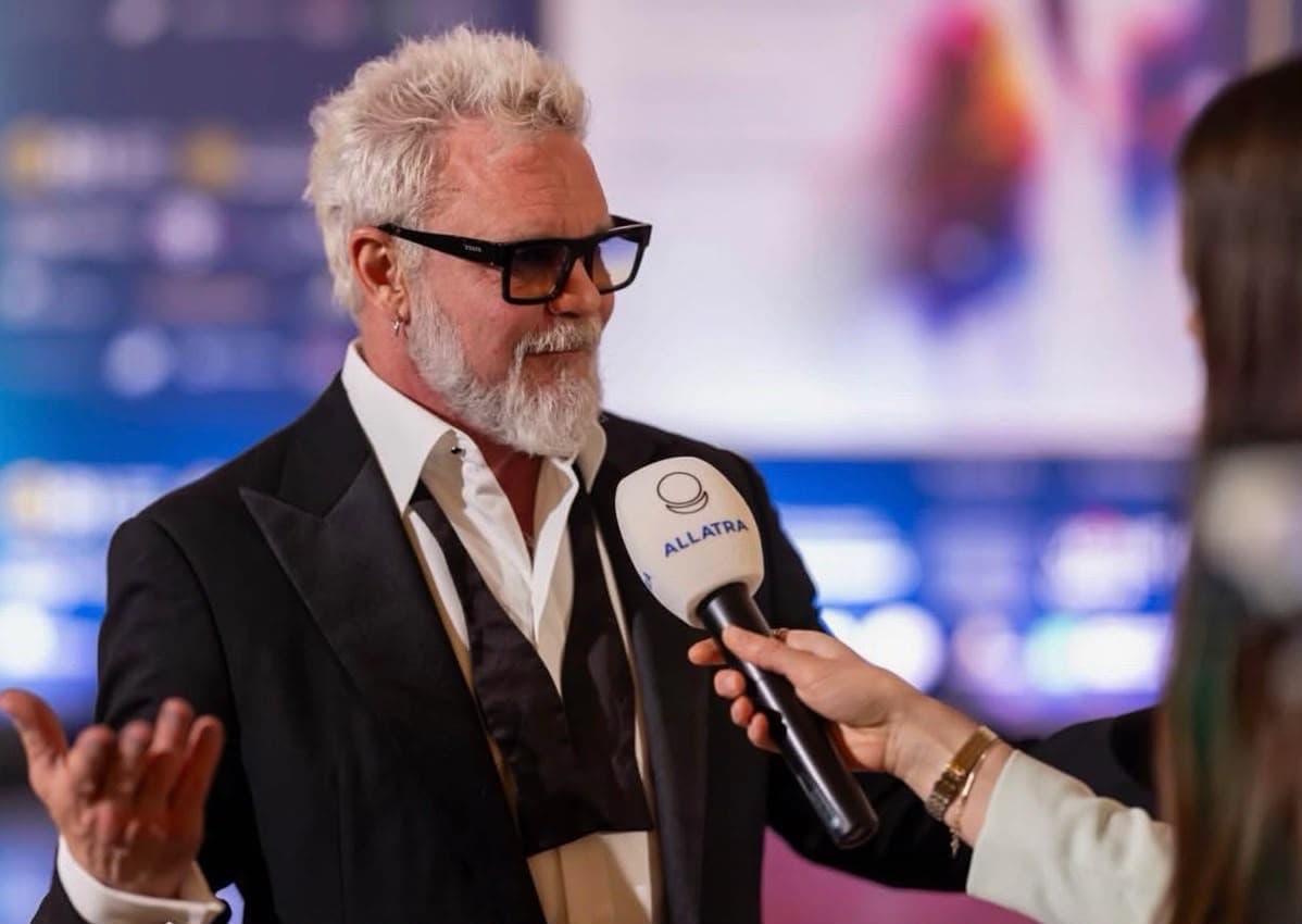 Rob Prior speaking on camera during a press interview